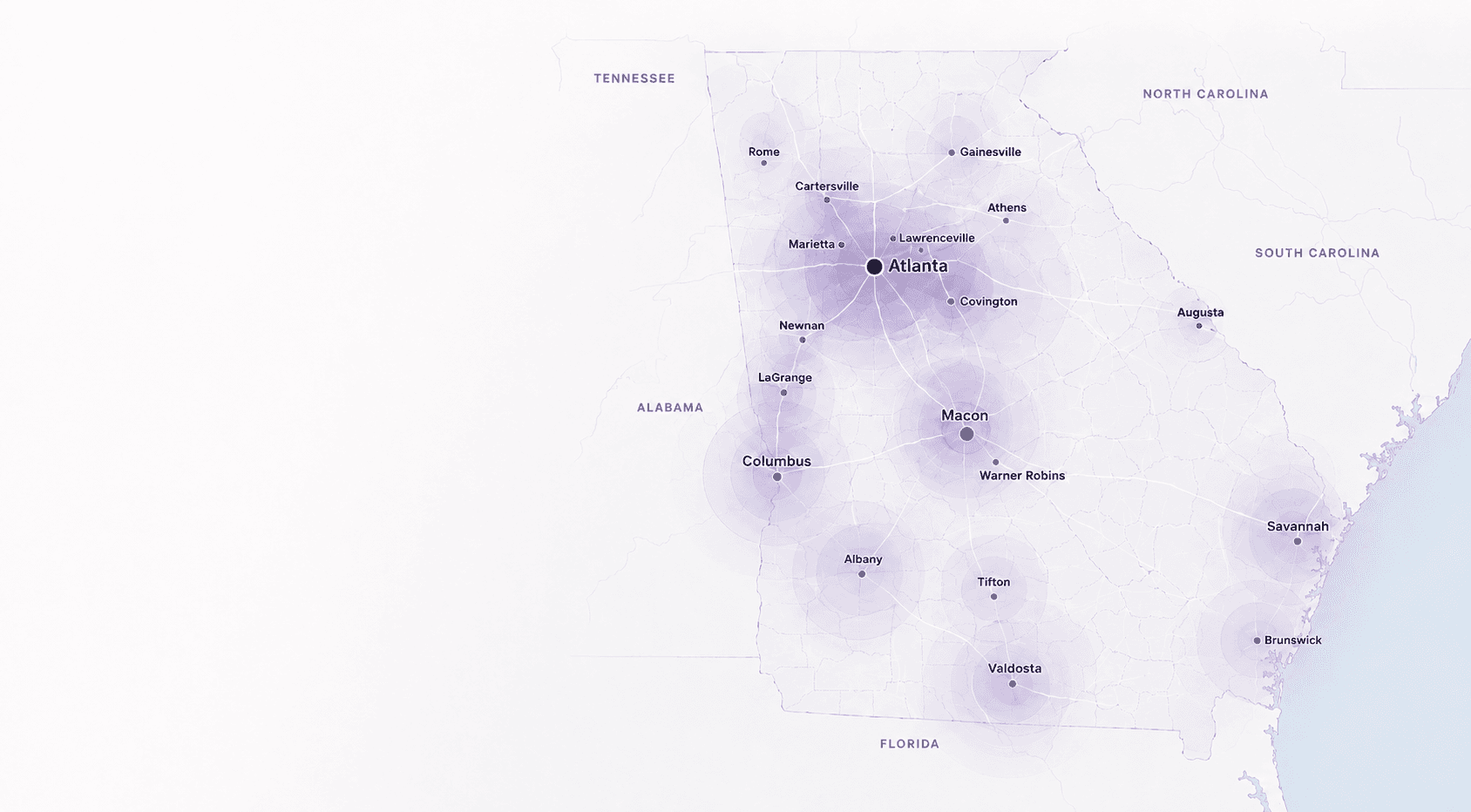 Map showing Undugu reach across Georgia communities, centered on Atlanta with markers including Macon, Columbus, Savannah, Brunswick, Valdosta, Albany, Augusta, Athens, Gainesville, Rome, Marietta, and other cities.